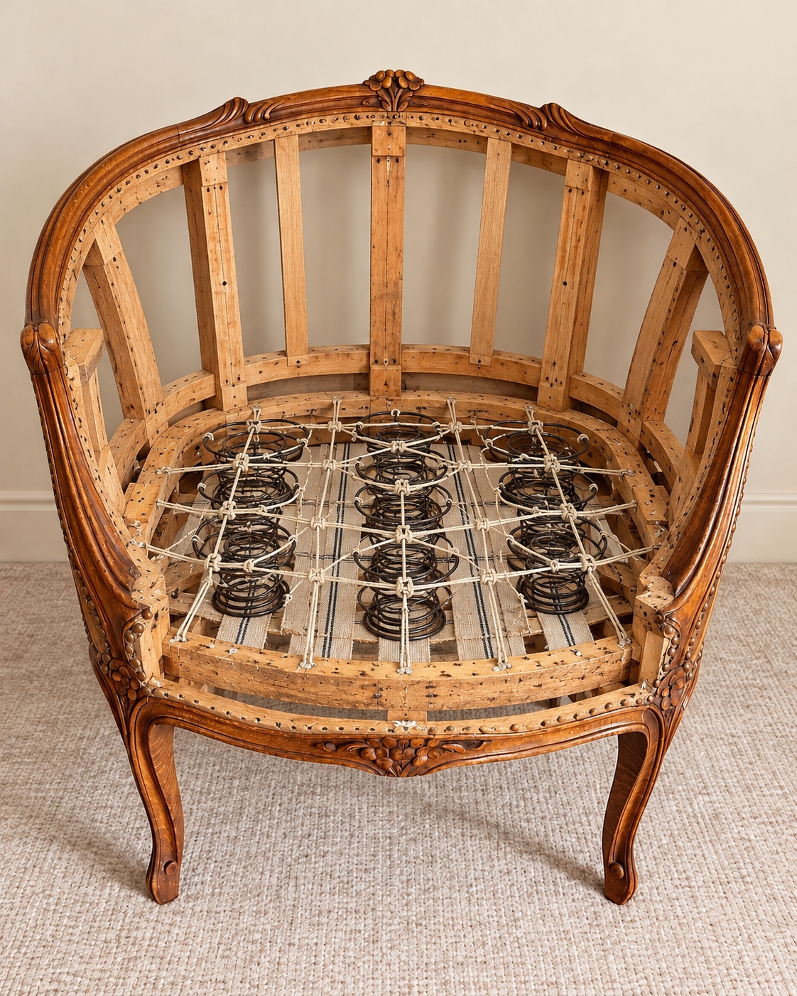Illustrated bare curved timber chair frame with seat springs, based on construction photographs from other Ken’s projects.