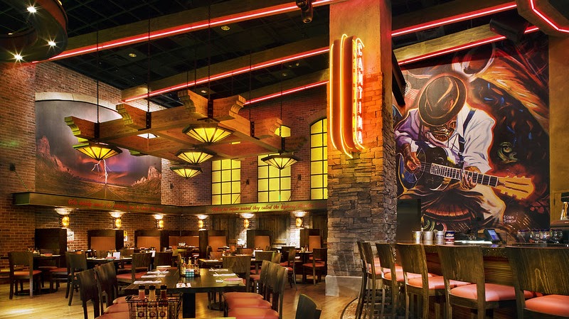 Restaurant interior with upholstered dining and bar seating